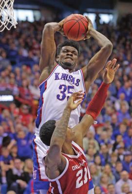 KANSAS CENTER Udoka Azubuike (35) rebounds over Oklahoma forward Kristian Doolittle (21) during a Feb. 15 game in Lawrence, Kan. Azubuike has come on strong as the Jayhawks are back at No. 1. (AP Photo)