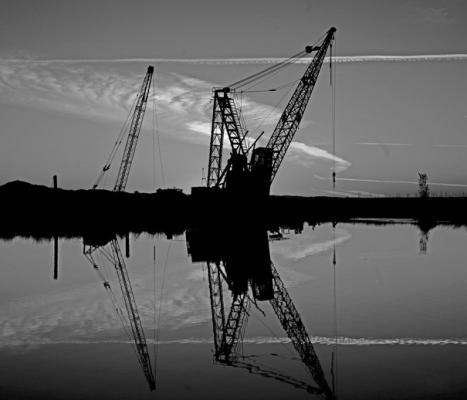 Dredging cranes rise over a section of the Sacramento-San Joaquin River Delta, in Isleton. (Gary Coronado/Los Angeles Times/ TNS)