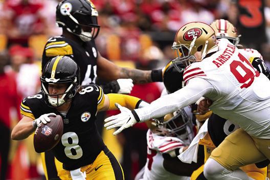 PITTSBURGH STEELERS quarterback Kenny Pickett (8) tries to avoid pressure from San Francisco 49ers defensive end Arik Armstead (91) in the first quarter at Acrisure Stadium on Sept. 10, 2023, in Pittsburgh. (Joe Sargent/Getty Images/TNS)