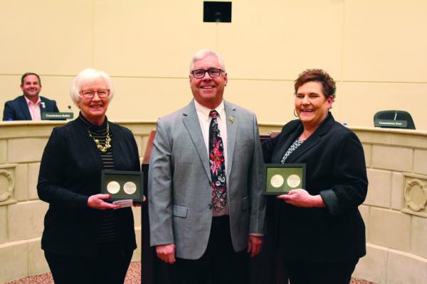 The Ponca City Board of Commissioners held on Monday, Feb. 27, was the last for outgoing commissioners Lanita Chapman (left) and Shasta Scott (right). Both were presented with service medallions by Vice-Mayor Paul Taylor (Photo by Calley Lamar)