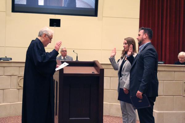 Judge Bill Kirkpatrick administered the Oath of Office to incoming Commissioners Kelsey Wagner and Garrett Bowers. They will begin their terms on Wednesday, March 1. (Photo by Calley Lamar)