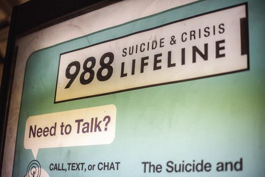 AN ADVERTISEMENT for the Suicide and Crisis Lifeline’s 988 hotline is seen at the Shaw-Howard University subway station in Washington, D.C. (Eric Harkleroad/KFF Health News/TNS)