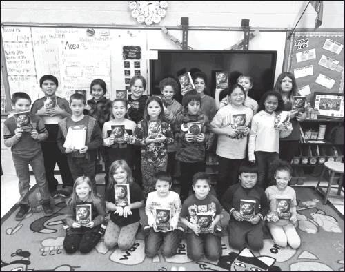 BRITTANY KINDSFATHER’S third grade class at Liberty Elementary displaying their dictionaries (Courtesy Photo)