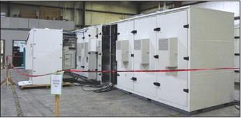 THESE ARE battery systems built by CME. Much like the PMZ roof units, these too are made in an assembly line fashion. They begin with a steel frame, then have aluminum panels added, along with electrical wiring and fire suppression systems. This is an example of where the various different disciplines come together for the manufacturing of a single product. These units are in the testing phase. (Photo by Calley Lamar)