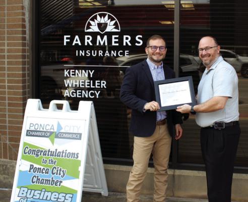 A PRESENTATION was held for the May Business of the Month, Farmers Insurance - Kenny Wheeler, by the Ponca City Chamber of Commerce on Wednesday, May 10 at 10 am. The office is located at 216 E. Grand Avenue. Pictured left to right: Kenny Wheeler and Chamber Business Council Chair Ben Evans. (Photo by Calley Lamar)