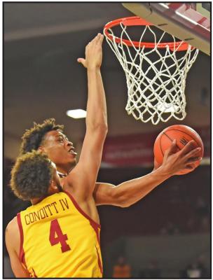 OKLAHOMA GUARD Alondes Williams shoots next to Iowa State forward George Conditt IV (4) during a college basketball game in Norman Wednesday. (AP Photo)