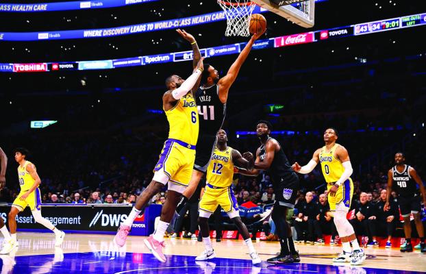 Trey Lyles #41 of the Sacramento Kings takes a shot against LeBron James #6 of the Los Angeles Lakers in the first half at Crypto. com Arena on Jan. 18, 2023, in Los Angeles, California. (Ronald Martinez/Getty Images/TNS)