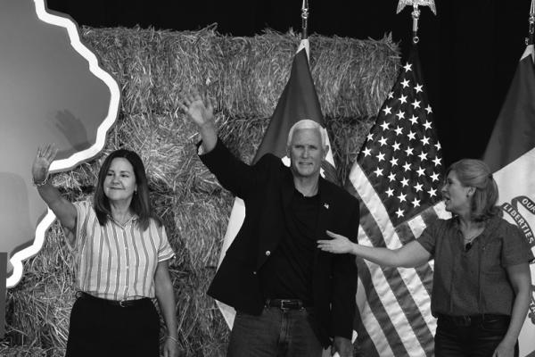 REPUBLICAN PRESIDENTIAL candidate former Vice President Mike Pence and his wife Karen are introduced by Senator Joni Ernst (R-IA) during the Joni Ernst’s Roast and Ride event on June 3, 2023, in Des Moines, Iowa. (Scott Olson/Getty Images/TNS)