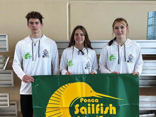 FOUR MEMBERS of the Ponca Sailfish Swim Club are participating in the USA Swimming Sectionals at Columbia, Mo., this weekend. Three are shown above, from left, Timothy Crank, Mattie Shearer and Jessalyn Carpenter. The fourth, Kyle King, is not in the photo.