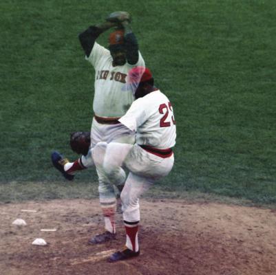 LUIS TIANT is seen in two images while pitching for the Boston Red Sox. Tiant holds the record for the most innings pitched in a season while not allowing a stolen base.