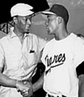 SINGER NAT King Cole greets Chicago White Sox standout Minnie Minoso. Minoso played in a Major League Baseball game at age 54 making him the second oldest player in MLB history behind 59-year-old Satchel Paige.