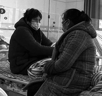 Patients with COVID-19 coronavirus rest in beds at Fengyang People’s Hospital in Fengyang County in east China’s Anhui Province on Jan. 5, 2023. (Noel Celis/AFP/Getty Images/TNS)