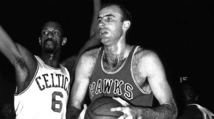 BOB PETTIT, right, was a great player for the St. Louis Hawks back in the 1950s. Here he competes against Bill Russell of the Boston Celtics in one of the many tense battles between the two teams.