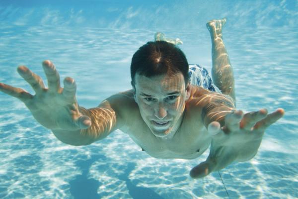 THE OCCASIONAL glance should be OK, but extended eye-opening underwater at the pool can cause damage. (Dreamstime/TNS)