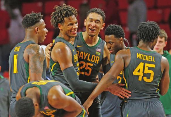 BAYLOR’S MARK Vital, Freddie Gillespie, Tristan Clark, Devonte Bandoo and Davion Mitchell, from left, celebrate after Baylor defeated Oklahoma 65-54 in a basketball game in Norman Tuesday. The Bears will face No. 3 Kansas Saturday. (AP Photo)