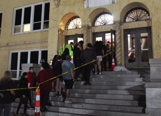 THE PEOPLE in the line on Saturday night waited with anticipation for their turn to go through the “Haunted Halls” experience put on by the Wildcat Theatre Company and Po-Hi Student Council. (Photo by Dailyn Emery)