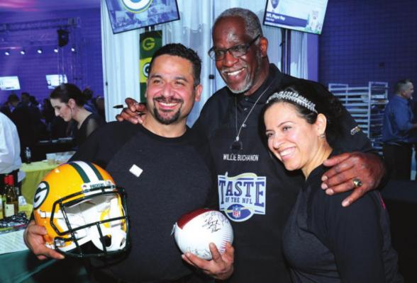 Former NFL player Willie Buchanon (center) and guests attend The 27th Annual Party With A Purpose on Feb. 3, 2018 in St Paul, Minnesota. (Adam Bettcher/Getty Images for Taste Of The NFL/TNS)