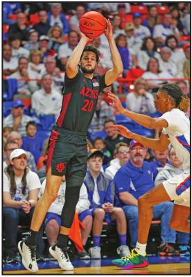 SAN DIEGO State guard Jordan Schakel (20) shoots a three-point basket against Boise State during a game Sunday in Boise, Idaho. The unbeaten Aztecs remain at No. 4 in the AP Poll. (AP Photo)