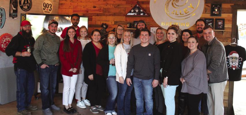 Ponca Young Employees (PYE) held a “Tab into PYE” event at Vortex Alley Brewing on Wednesday, Feb. 15. Many of those who attended the event brought canned goods for Peach Tree Landing. (Photo by Calley Lamar)