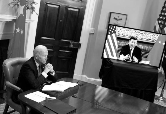 U.S. President Joe Biden meets with China’s President Xi Jinping during a virtual summit from the Roosevelt Room of the White House in Washington, D.C., Nov. 15, 2021. (Mandel Ngan/AFP/ Getty Images/TNS)