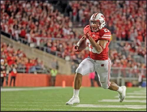 JONATHAN Taylor of Wisconsin runs for a touchdown during a 2018 game against Nebraska in Madison, Wis. College football’s race for its top individual awards this season will have a couple of standout players seeking repeats. Taylor won the Doak Walker Award as the nation’s top running back last season, while Alabama’s Jerry Jeudy earned the Fred Biletnikoff Award as college football’s most outstanding receiver. Both players are back for their junior seasons. (AP Photo)