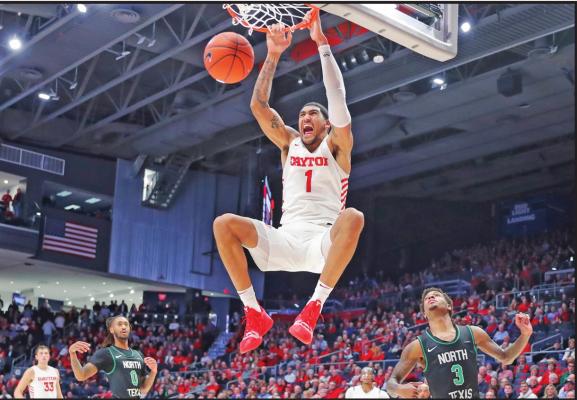 DAYTON”S OBI Toppin (1) dunks as North Texas’ Javion Hamlet (3) looks on during a college game in Dayton, Ohio, early in the 2019-2020 season. Toppin is the lone unanimous first-team choice to The Associated Press men’s college basketball All-America team (AP Photo)