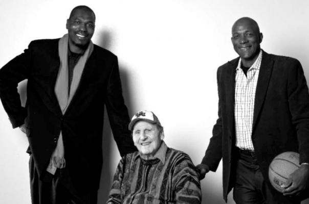 LEGENDARY HOUSTON basketball Coach Guy Lewis (center) on the occasion of his being inducted into the Basketball Hall of Fame. With him are two of his greatest players, Hakeem Olajuwon, left, and Clyde Drexler.