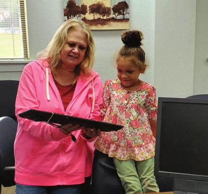Edwin Fair Staff Member, Barbi Wimberley presented computer giveaway winner, four year old Ava Robinson with a computer this week. This computer will help her to participate in Distance Learning practice days and in Distance Learning, if that event were to occur this school year. (Photo provided by April Lee, Office Manager at Edwin Fair Mental Health).