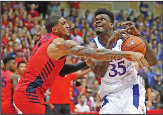 DAYTON FORWARD Obi Toppin (1) knocks the ball away from Kansas center Udoka Azubuike (35) during to Nov. 27 game in Hawaii. Kansas and Dayton were headed toward earning No. 1 seeds in the NCAA tournament, so any meeting would have to be in the Final Four or national championship game. What a rematch it would be. The Jayhawks and Flyers played a high-level game at the Maui Invitational, won 90-84 in overtime by Kansas. (AP Photo)