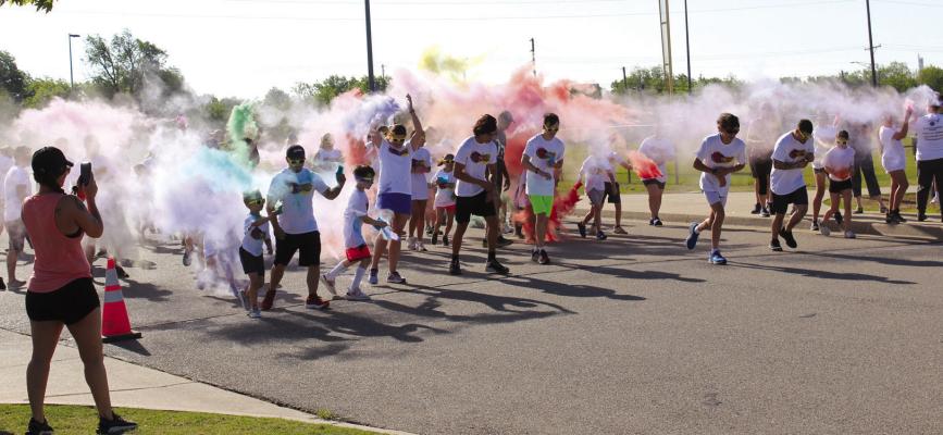 The third annual 5K Color Blast Fun Run was held at the Ponca City RecPlex at 9 am on Saturday, May 6. Pictured is the start of the run, participants were provided with different colored powdered dyes that were thrown into the air. Participants start the race with a clean white t-shirt that is stained with the various colors from the start of the run and color stations throughout the course. (Photo by Calley Lamar)