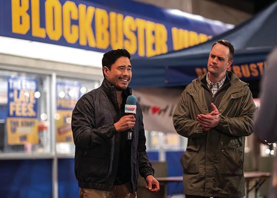 Randall Park, left, and Simon Druker in “Blockbuster.” (Ricardo Hubbs/Netflix/ TNS)