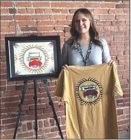 ARTIST KAYLA Maxwell, with her original ledger art painting and this year’s Standing Bear Pow Wow t-shirt. The shirts will be on sale at the pow wow scheduled for September 29th and 30th. (Photo provided)