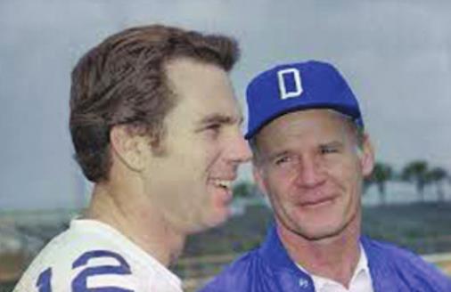 ROGER STAUBACH of the Dallas Cowboys is shown here with legendary Cowboys coach Tom Landry. Staubach won the Heisman Trophy playing for the U. S. Naval Academy.