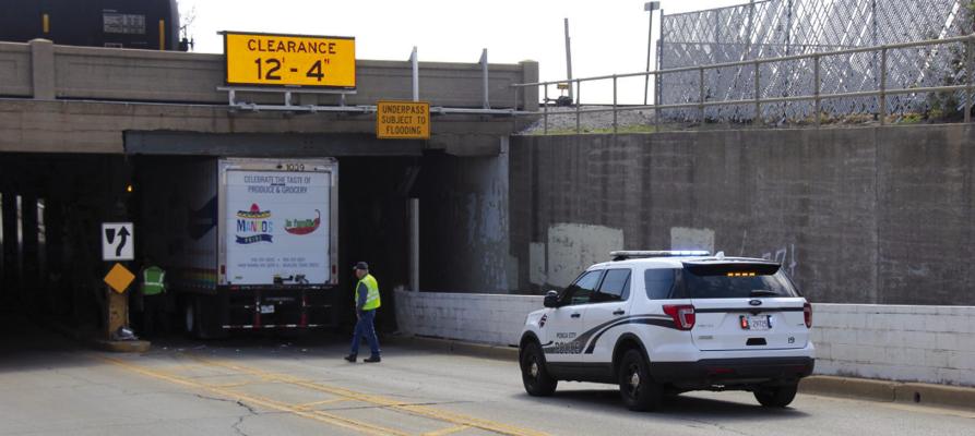 A semi truck became stuck underneath the South Ave. underpass around 11 am on Mon., April 10. (Photo by Dailyn Emery)